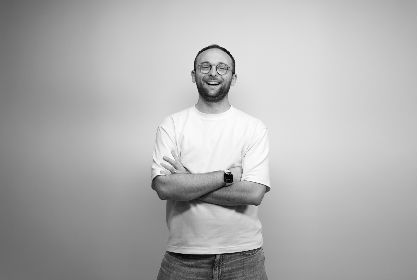 Max Rickards, laughing with arms crossed